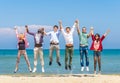 Friends jumping on the beach Royalty Free Stock Photo