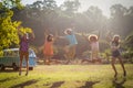 Friends jumping in excitement in park Royalty Free Stock Photo