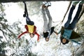 Friends jumping upside down Royalty Free Stock Photo