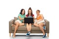 Friends with laptop computer sitting on sofa Royalty Free Stock Photo