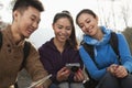 Friends looking at the picture on the screen of digital camera Royalty Free Stock Photo