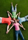 Friends lying on grass Royalty Free Stock Photo