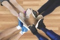 Friends make foot circle on the floor