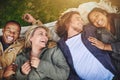 Friends make life worth living. a group of young friends having fun at a picnic.