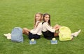 Friends makes you happy. School friends relax on green grass. Happy friends back to school. Classmate friends. School