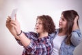 Friends making selfie. Two beautiful young women making selfie Royalty Free Stock Photo