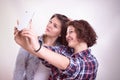 Friends making selfie. Two beautiful young women making selfie Royalty Free Stock Photo