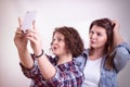 Friends making selfie. Two beautiful young women making selfie Royalty Free Stock Photo