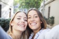 Smiling friends making selfie. Two beautiful young women making selfie Royalty Free Stock Photo