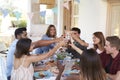 Friends making a toast at a dinner party on a patio, Ibiza Royalty Free Stock Photo