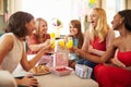 Friends Making A Toast With Orange Juice At Baby Shower