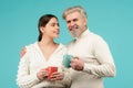 Friends meeting. Happy couple drinking tea. Morning cup, coffee mug, people on isolated background with copy space Royalty Free Stock Photo