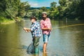 Friends men with fishing rod and net. Set up rod with hook line sinker. Legend has retired. Two male friends dressed in Royalty Free Stock Photo