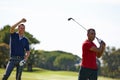 Friends, men and golf with swing for hobby, recreation and exercise on grass field outdoor. Happy, group and athlete on Royalty Free Stock Photo