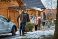 Friends on mountain preparing house for New Year eve