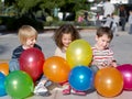 Friends with multi-coloured inflatable spheres Royalty Free Stock Photo