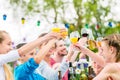 Friends and neighbors toasting on garden party Royalty Free Stock Photo