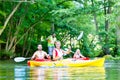 Friends paddling with canoe on forest river Royalty Free Stock Photo