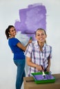 Friends painting a wall