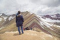 Friends with panoramic views. Hiking scene in Vinicunca, Cusco region, Peru. Montana of Seven Colors, Rainbow Mountain Royalty Free Stock Photo