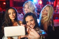 Friends, party and selfie at a club, bar or fun event to celebrate new years, birthday and nightlife while together with