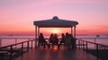 friends party on summer evening,people relaxing on sunset promenade in restaurant at summer night Royalty Free Stock Photo