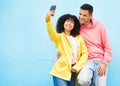 Friends, phone and smile for selfie on a blue background for fashion, style or friendship together. Young man and woman Royalty Free Stock Photo