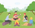 Friends on picnic outside a city, guy plays guitar, girl sits on grass, man scroll smartphone