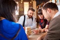 Friends play board games at the table