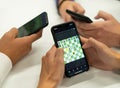 Friends play chess on their smartphones online