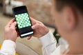 Friends play chess on their smartphones online