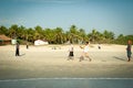 Friends play cricket on the beach of GOA in India. The guys play Indian baseball on the beach. Indian national sport