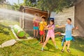 Friends play water gun fight in the garden Royalty Free Stock Photo