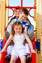 Friends on the playground slide Royalty Free Stock Photo