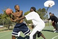 Friends Playing Basketball On Court