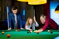 Friends playing billiard Royalty Free Stock Photo