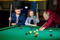 Friends playing billiard Royalty Free Stock Photo