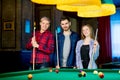 Friends playing billiard Royalty Free Stock Photo