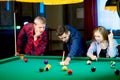 Friends playing billiard Royalty Free Stock Photo