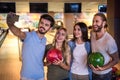 Friends playing bowling Royalty Free Stock Photo