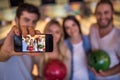 Friends playing bowling Royalty Free Stock Photo