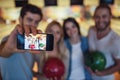 Friends playing bowling Royalty Free Stock Photo