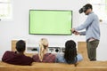 Friends Playing Computer Game With Virtual Reality Headset Royalty Free Stock Photo