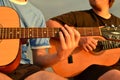 Friends playing guitar Royalty Free Stock Photo