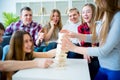 Friends playing jenga