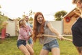 Friends playing tug of war Royalty Free Stock Photo