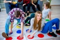 Friends playing twister Royalty Free Stock Photo