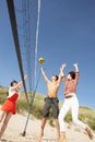 Friends Playing Volleyball On Beach Royalty Free Stock Photo