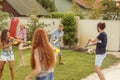 Friends playing with water guns Royalty Free Stock Photo