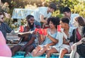 Friends, pool party and cheers on summer vacation with happy people drinking and laughing with feet in water. Friendship Royalty Free Stock Photo